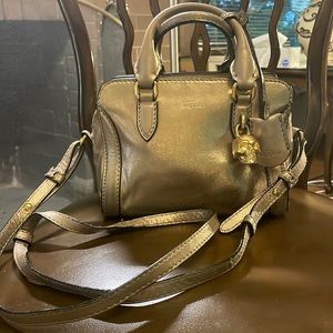 ALEXANDER MCQUEEN. Gold leather mini skull padlock bag. Crossbody & top handle.